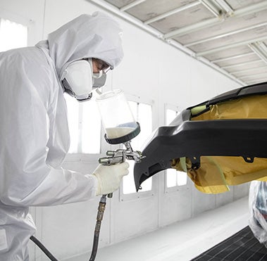 Collision Center Technician Painting a Vehicle | Pueblo Toyota in Pueblo CO